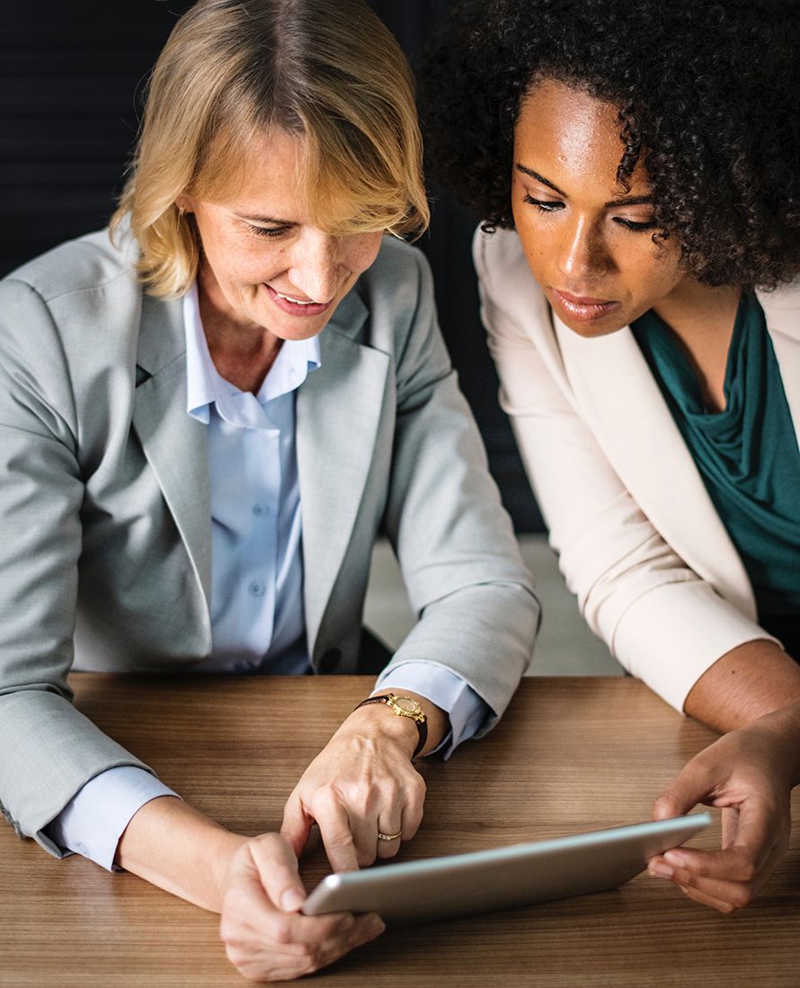 two women reviewing report